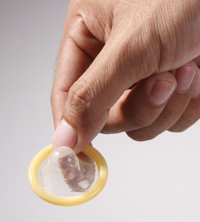 stock image of the man holding condomの写真素材