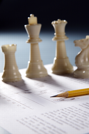 chess piece on the finacial reportの写真素材