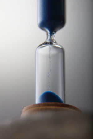 Hourglass - Grains of sand falling down