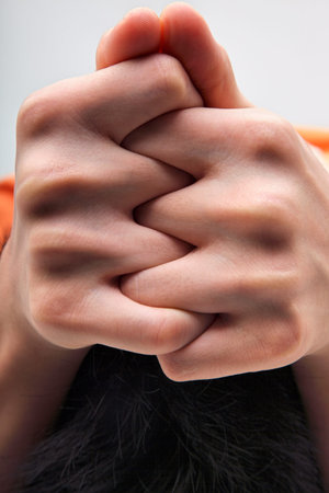 man holding the finger tight