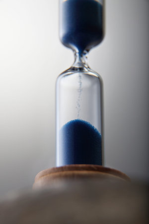 Hourglass - Grains of sand falling down