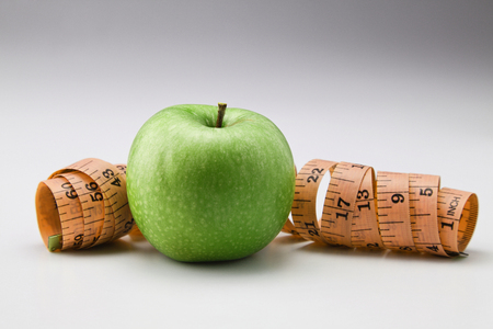 stock image of the measuring tape and appleの写真素材