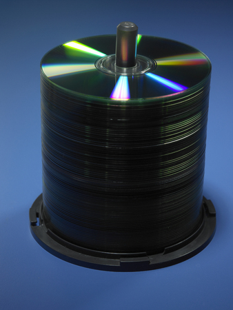 stack of cd or dvd on the blue backgroundの写真素材