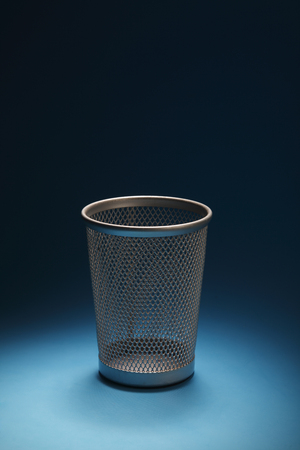 empty trash bin  on the blue backgroundの写真素材