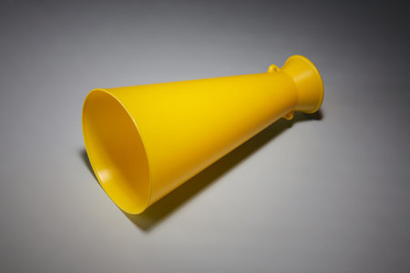 A Yellow Plastic Haler For Making Announcement In Public