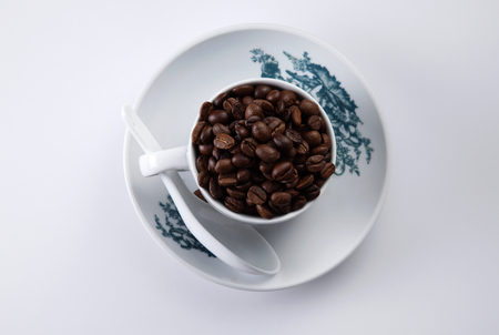 top view of the cup filled up with coffee beanの写真素材