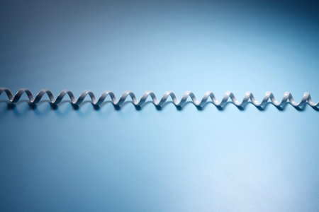 white phone cord on the blue background