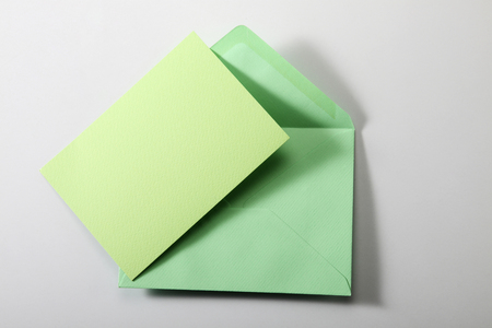 envelope with blank paper isolate in plain backgroundの写真素材