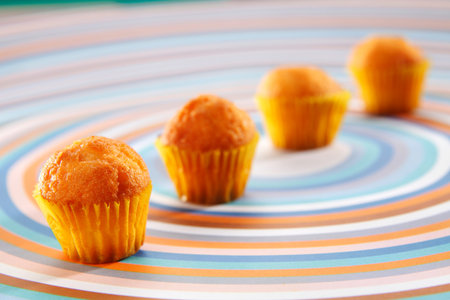 Freshly baked yellow muffins close up shoot