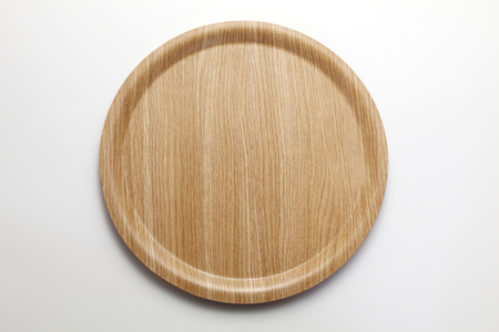 wooden serving tray on the palin backgroundの写真素材