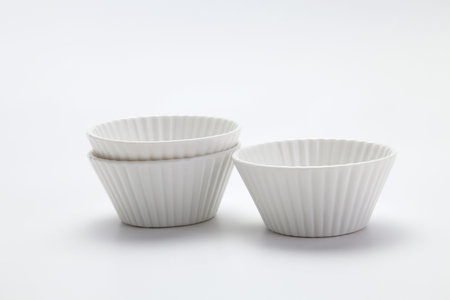 procelain muffin mold on the plain background
