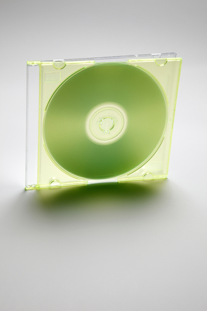 Computer or music cd with green cd case and blank labelの写真素材