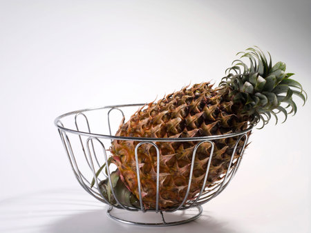 Single pineapple fruit isolated on plain backgroundの写真素材