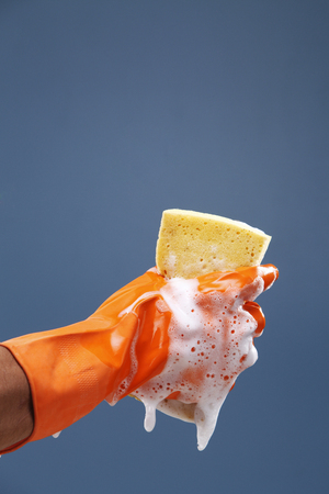 Squeezing sponge, squeezing wet sponge.の写真素材