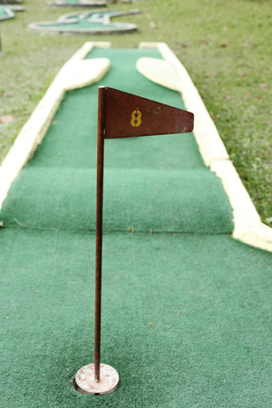 number eight flag on a mini golf courseの写真素材