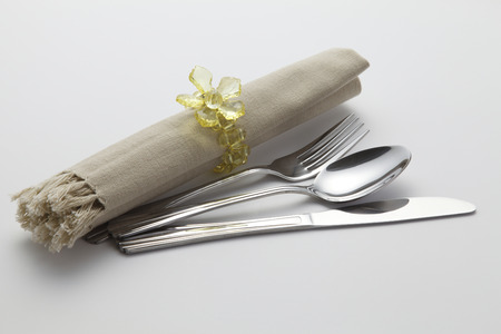 cutlery set with rolled napkin and holderの写真素材