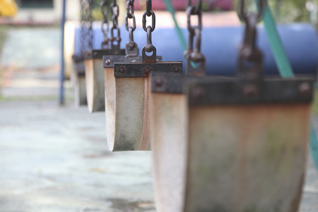 close up of swings at an empty playgroundの写真素材