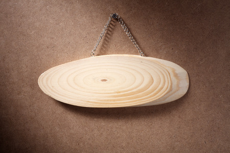 Oval wooden sign isolated on white background.の写真素材