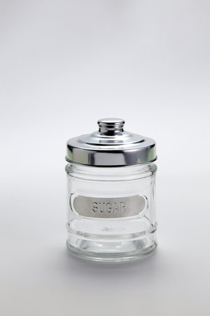 empty sugar container on the plain backgroundの写真素材