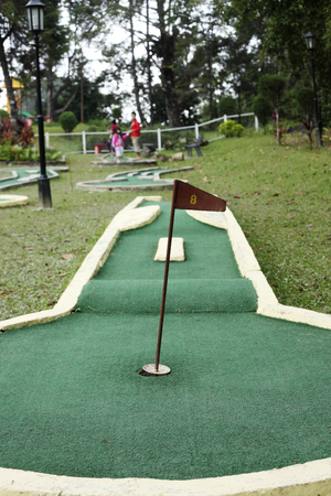 number eight flag on a mini golf courseの写真素材