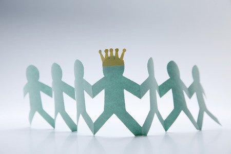 Paper chain  holding hands together.の写真素材