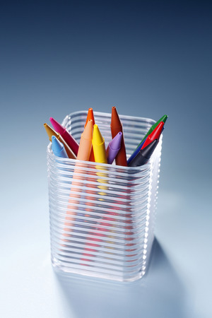 Transparent plastic box filled with crayons.の写真素材