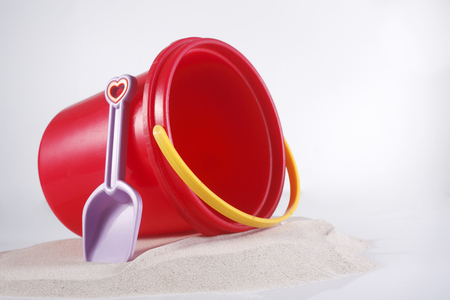 Red bucket with spade isolated on the white background.の写真素材