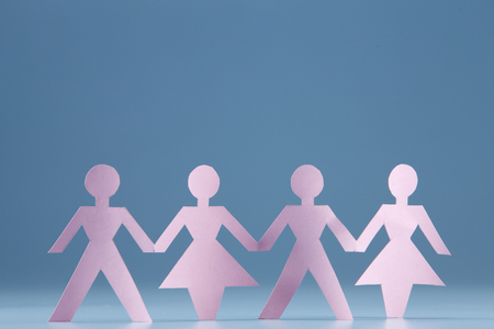 Paper chain holding hands together.の写真素材