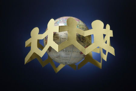Paper chain surrounding a globe.の写真素材