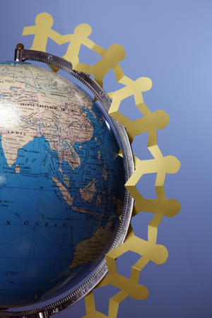 Paper chain hung around the globe.の写真素材