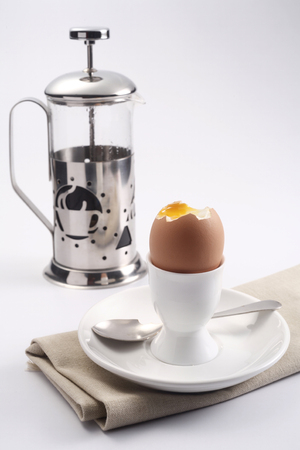Half boiled egg and coffee presser.の写真素材