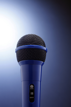 Blue microphone isolated on the background.の写真素材