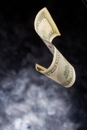 Banknote floating down the background.