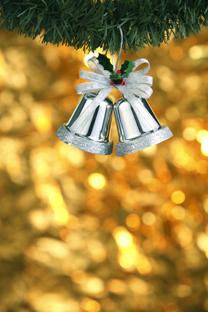 Silver bells hung on the tree.の写真素材