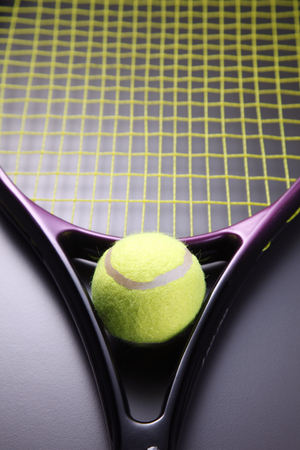 Tennis racquet with ball isolated on the background.の写真素材