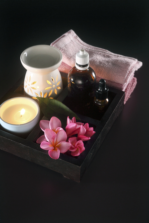 towel ,burner ,candle ,essential oil and flowerの写真素材