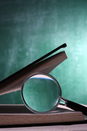 magnifier resting on the open page bookの写真素材