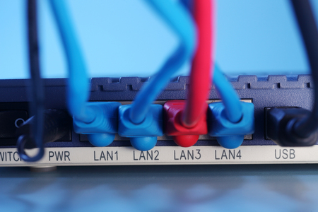 close up of the internet Cables Plugged into Routerの写真素材