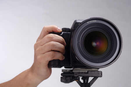 stock image of the camera mounting on the tripodの写真素材