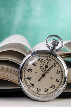 stop watch in front of the bookの写真素材