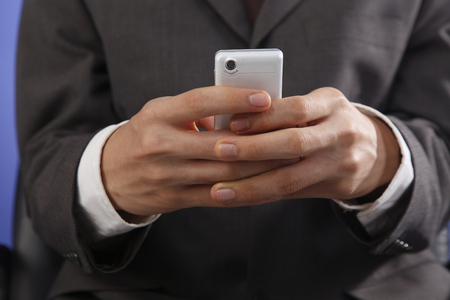 stock image man using mobile phoneの写真素材