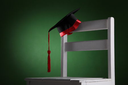 mortar board on the chairの写真素材