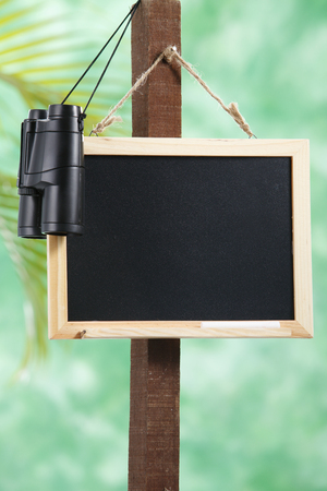 stock image of the black board and the binocularの写真素材