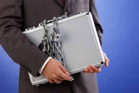 man holding the brief case with extra lock