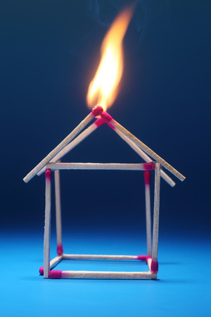 close up matchstick house is burningの写真素材