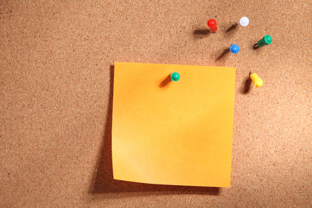 Note paper on cork bulletin boardの写真素材