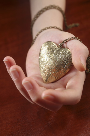 hand holding a necklessの写真素材