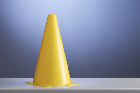 Yellow cone on white background with copyの写真素材
