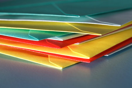 Close up pile of coloured envelopes