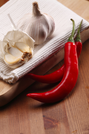 close up of the chilli and garlic on the cutting boardの写真素材